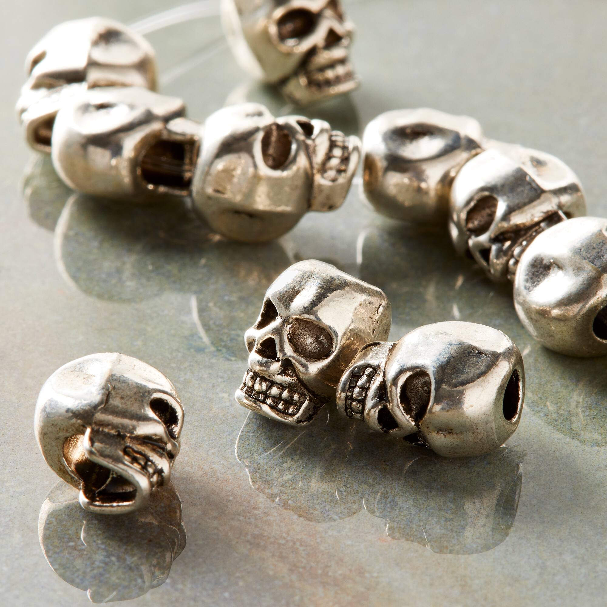 9 Packs: 12 ct. (108 total) Silver-Plated Metal Skull Beads, 12mm by Bead Landing™
